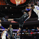 The Sixers’ Robert Covington blocks the Nets’ Joe Harris during last night’s game.